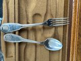 two forks and two spoons in a case
