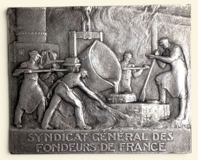 plaque depicting a group of men working in a factory