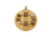 an image of a pendant with various stones on a white background