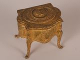 an image of a gold colored box on a white surface