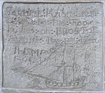 an image of a stone plaque with a ship on it