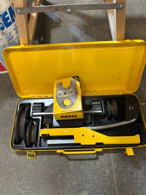 a tool in a yellow case on the floor