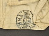 an image of a pair of pants with a pin in the pocket