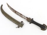 pair of old and rusty knifes on a white surface