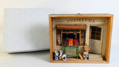 a small wooden box with a doll house inside of it