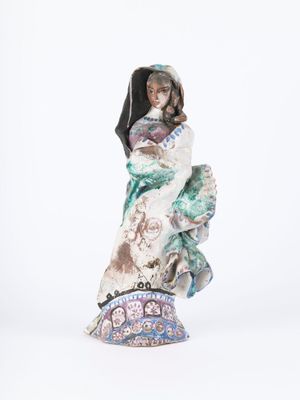 figurine of a woman holding a child in her arms