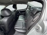 the interior of a car with black leather seats and a steering wheel