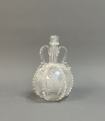 a glass vase that is sitting on a table