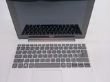 a laptop computer sitting on top of a white table