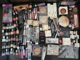 a lot of makeup and makeup products on the table