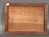 an old wooden picture frame with a piece of wood in it