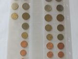 a lot of coins in a plastic bag on a table