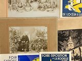 a lot of postcards that are on a table