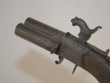 an old gun that is on display in a museum
