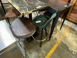 a table with four chairs and a refrigerator in the background