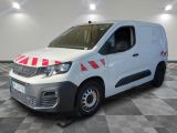 the white van is parked on a checkered floor in a room
