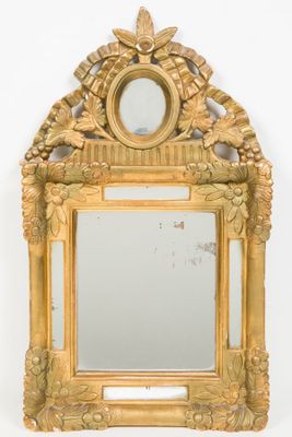 an image of a mirror with a gold frame on a white background