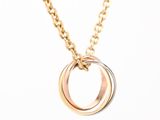 a close up of a necklace with two rings on a chain