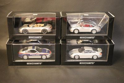 three boxed boxes of toy cars on a table with a black background