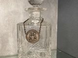 a bottle of perfume sitting on top of a glass table