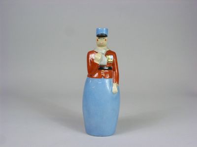 une figurine représentant un homme vêtu d'une robe bleue et d'un chapeau