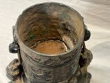 a very old vase that is sitting on a table