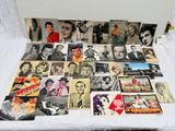 a bed with a lot of old photos on it
