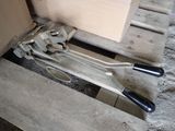 a wooden pallet with a pair of wrenes on it
