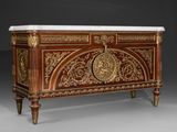 an ornately decorated chest with a marble top