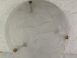 a glass plate with a design on it on the wall