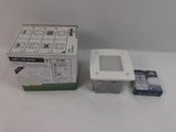 a box and a box of electronic equipment on a table