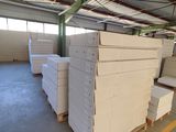 many stacks of boxes in a warehouse with a lot of them