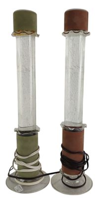 two candles that are sitting on top of each other