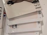 a lot of books that are stacked on top of each other