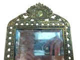 a person taking a picture of themselves in a mirror