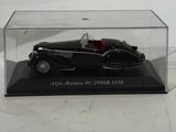 an image of a model of a black car in a clear case