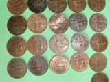 a lot of coins that are on a green surface
