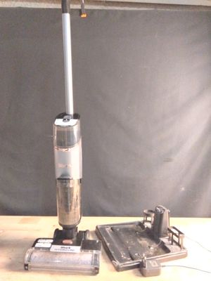 a vacuum that is sitting on a table next to a mouse