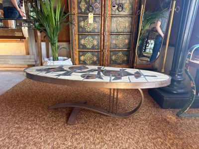 a coffee table with a mosaic design on it