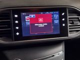 the dashboard of a car with a digital display in the center