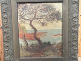 tableau représentant un arbre sur un chevalet, avec un lac en arrière-plan