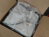 a cardboard box with a laptop in it on the floor