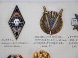 a lot of badges that are on a piece of paper