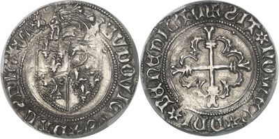 une pièce d'argent avec une croix au recto et un lion au verso