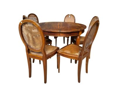 a wooden table with four chairs around it