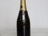 a bottle of champagne sitting on a marble table