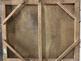 an old wooden box with a glass door on top of it