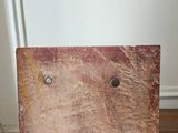 a piece of wood sitting on top of a dresser