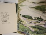 un livre dans lequel figure l'image d'une rivière