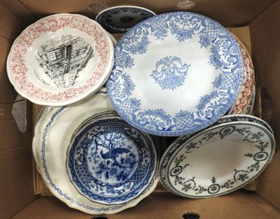 many plates in a box that are sitting in the box